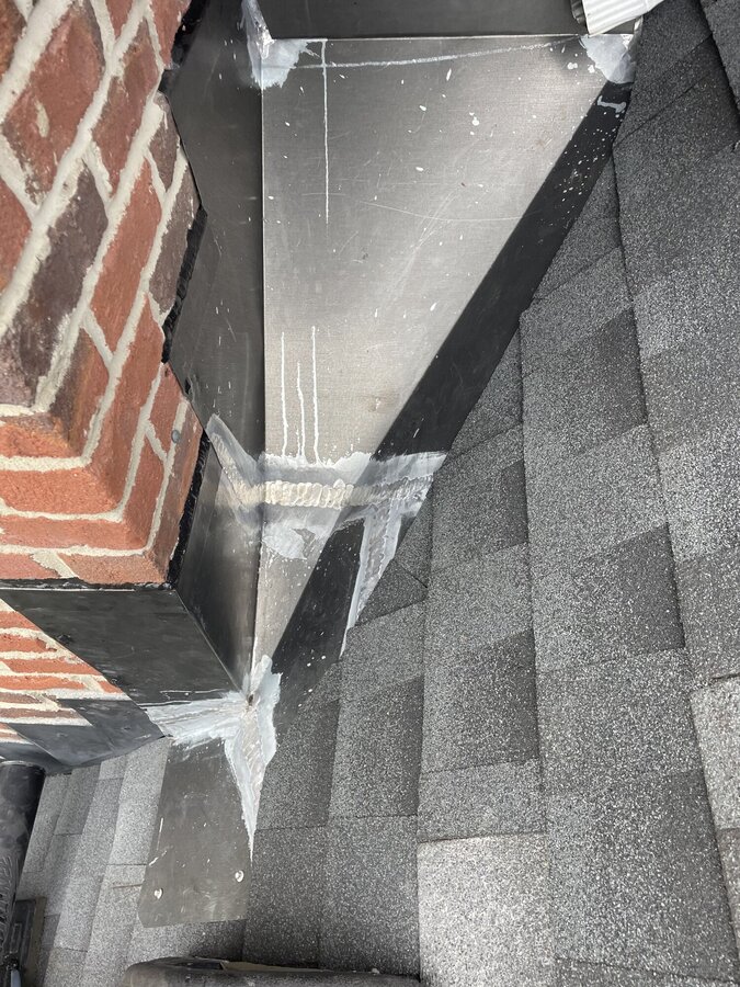 Step flashing chimney wall